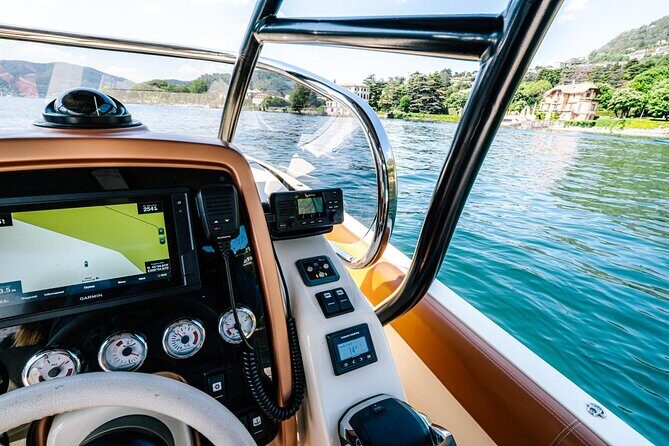 4H Private Cruise Bellagio Varenna Tender Yacht Invictus 6 Pax - Como’s pier landmarks: Villa Olmo, the Electric monument, and seaplane-area scenery